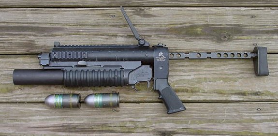 That one is a real deal LMT M203 with a 37mm tube. 